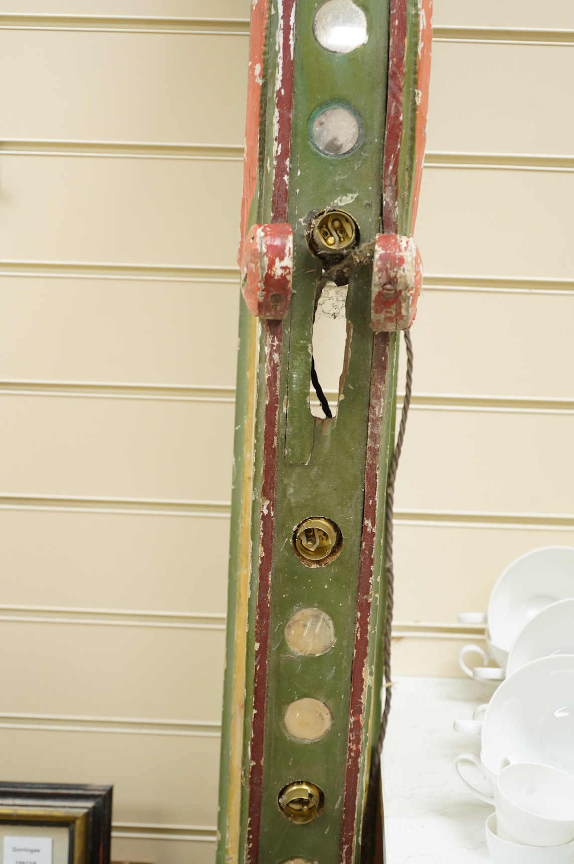 A painted wood carousel rail with light fittings, 185cm high